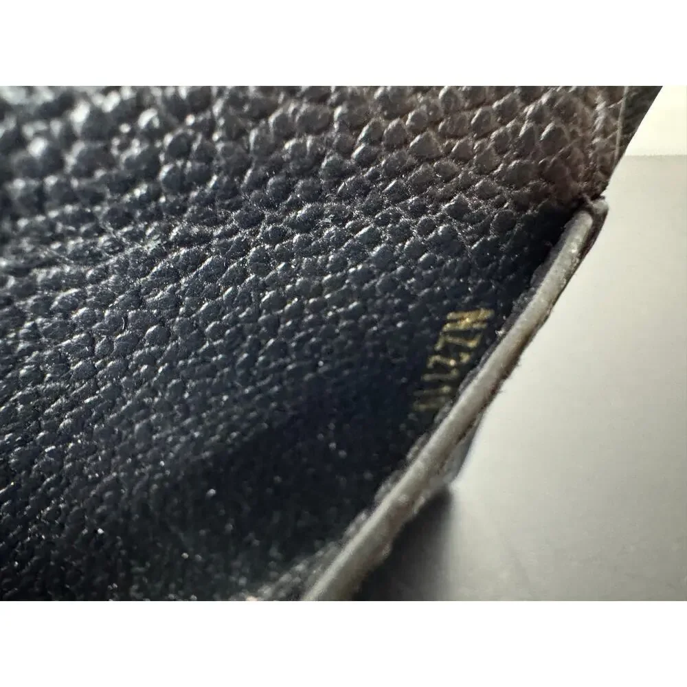 Louis Vuitton | Mélanie Pochette – Monogram Empreinte Leather